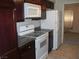 Kitchen with dark wood cabinets and granite countertops at 2838 Loveland Dr # 1619, Las Vegas, NV 89109