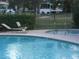 Community pool and spa with lounge chairs at 2838 Loveland Dr # 1619, Las Vegas, NV 89109