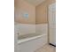 Clean bathtub with a door to the bathroom at 2851 S Valley View Blvd # 1172, Las Vegas, NV 89102