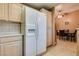 Kitchen with white refrigerator and view into dining area at 2851 S Valley View Blvd # 1172, Las Vegas, NV 89102