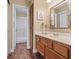 Clean bathroom with wood cabinets and a shower/tub combo at 3321 Mariner Bay St, Las Vegas, NV 89117