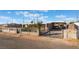 Single-story home with a covered carport and gated yard, perfect for outdoor activities at 3327 Rio Grande St, Las Vegas, NV 89115