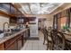 Kitchen area offering dark cabinetry, essential appliances, dining area, and ample counter space at 3327 Rio Grande St, Las Vegas, NV 89115