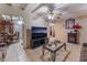 Inviting living room showcasing tile floors, beamed ceiling, classic decor, and a dining space at 3327 Rio Grande St, Las Vegas, NV 89115