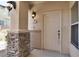 White front door with stone accents at 3555 Meridale Dr # 1145, Las Vegas, NV 89147