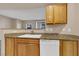 Kitchen with wood cabinets, granite countertops and dishwasher at 3555 Meridale Dr # 1145, Las Vegas, NV 89147