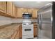 Kitchen with wood cabinets and stainless steel appliances at 3555 Meridale Dr # 1145, Las Vegas, NV 89147