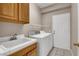 Laundry room with washer, dryer, cabinets, and utility sink at 3555 Meridale Dr # 1145, Las Vegas, NV 89147