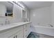 Stylish bathroom featuring a double vanity, soaking tub, and modern fixtures at 3663 Laguna Verde Way, Las Vegas, NV 89121