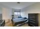 Bedroom featuring neutral colored walls, minimal decor, a dresser, and a window at 3663 Laguna Verde Way, Las Vegas, NV 89121