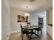 Charming dining room features an elegant table and chairs, complemented by a decorative light fixture at 3663 Laguna Verde Way, Las Vegas, NV 89121