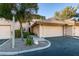 Exterior front view featuring a 2-car garage, tiled roof, and desert landscaping at 3663 Laguna Verde Way, Las Vegas, NV 89121