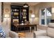 Elegant dining area with built-in shelving and a charming wooden table at 38 Strada Principale, Henderson, NV 89011