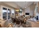 Open dining area with large farmhouse table and mountain views at 38 Strada Principale, Henderson, NV 89011