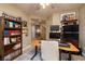 Spacious home office with a standing desk and ample shelving at 38 Strada Principale, Henderson, NV 89011