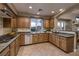 Spacious kitchen with granite counters and wood cabinetry at 38 Strada Principale, Henderson, NV 89011