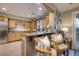 Modern kitchen with granite countertops and wood cabinets at 38 Strada Principale, Henderson, NV 89011