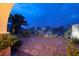 Landscaped backyard with stone pathway and desert plants at 38 Strada Principale, Henderson, NV 89011