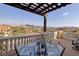 Covered patio with glass-top table, chairs, and mountain views at 38 Strada Principale, Henderson, NV 89011