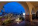 Covered patio with arched entryway, mountain views and landscaping at 38 Strada Principale, Henderson, NV 89011