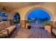 Inviting patio with arched entryway, comfortable seating and mountain views at 38 Strada Principale, Henderson, NV 89011