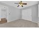 Bedroom with neutral walls, carpet flooring, a ceiling fan, and an ensuite bathroom at 3923 Gramercy Ave, North Las Vegas, NV 89031