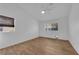 Bright bedroom features tile floors, a ceiling fan, and natural light from two windows at 3923 Gramercy Ave, North Las Vegas, NV 89031