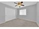 Bedroom with neutral walls, carpet flooring, a ceiling fan, and a closet with sliding doors at 3923 Gramercy Ave, North Las Vegas, NV 89031