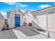 Backyard view of a detached building with a contrasting blue door set against a sunny sky at 3923 Gramercy Ave, North Las Vegas, NV 89031