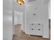 Hallway with storage cabinet and tiled floors leading to other rooms in the house at 3923 Gramercy Ave, North Las Vegas, NV 89031