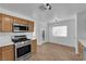 Eat-in kitchen featuring stainless steel appliances, a gas range, and white countertops at 3923 Gramercy Ave, North Las Vegas, NV 89031