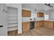 Bright kitchen featuring wooden cabinets, white countertops, stainless steel appliances, and a spacious walk-in pantry at 3923 Gramercy Ave, North Las Vegas, NV 89031