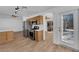 Kitchen area leading to outdoor space, featuring stainless steel appliances, and wood flooring at 3923 Gramercy Ave, North Las Vegas, NV 89031