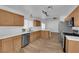 Spacious kitchen featuring stainless steel appliances, oak cabinets, and white countertops at 3923 Gramercy Ave, North Las Vegas, NV 89031