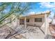 Inviting covered patio providing a shaded outdoor space for relaxation and entertaining. Includes a decorative tree at 3923 Gramercy Ave, North Las Vegas, NV 89031