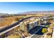 Modern three-story home with desert landscaping, situated near a landscaped retaining wall at 4342 Guava Ct # 0, Las Vegas, NV 89135