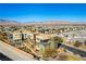 Three-story home boasting balconies, desert landscaping, and mountain views at 4342 Guava Ct # 0, Las Vegas, NV 89135