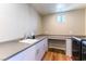 Well-lit laundry room with countertop, sink, and modern appliances at 4342 Guava Ct # 0, Las Vegas, NV 89135