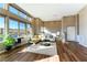 Modern living room featuring tall windows, hardwood floors, neutral tones, and an open layout at 4342 Guava Ct # 0, Las Vegas, NV 89135