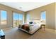 Serene main bedroom with balcony access, soft carpet, neutral tones and city views at 4342 Guava Ct # 0, Las Vegas, NV 89135