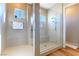 Walk-in shower featuring dual shower heads, tile surround, and built-in bench at 4342 Guava Ct # 0, Las Vegas, NV 89135