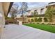 This backyard features a manicured lawn and outdoor kitchen with built in grill at 4929 Summit Overlook Dr, Las Vegas, NV 89135