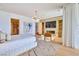 Bright main bedroom features a fireplace, walk-in closet, and hardwood floors at 4929 Summit Overlook Dr, Las Vegas, NV 89135