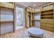 Spacious walk-in closet features custom shelving and an adjoining bathroom at 4929 Summit Overlook Dr, Las Vegas, NV 89135