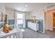 Bedroom featuring a crib, dresser, and whimsical wall decor at 4949 Apple Mesa Ave # 213, Las Vegas, NV 89139