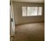 Bright bedroom with large window and carpet at 5046 S Rainbow Blvd # 103, Las Vegas, NV 89118