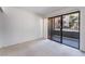 Bedroom boasting sliding glass doors to balcony at 5046 S Rainbow Blvd # 103, Las Vegas, NV 89118