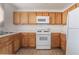 Kitchen featuring cabinets, oven, microwave and refrigerator at 5046 S Rainbow Blvd # 103, Las Vegas, NV 89118