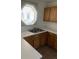 Kitchen with wood cabinets, sink, and window at 5046 S Rainbow Blvd # 103, Las Vegas, NV 89118