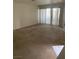 Spacious living room with carpet and sliding doors at 5046 S Rainbow Blvd # 103, Las Vegas, NV 89118